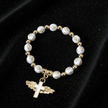 White & Gold Cross Bead Angel Wing Cross Charm Stretch Bracelet - DP Online